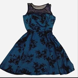 Trixxi babydoll fit and flare dress with a dark floral velvet pattern and a mesh